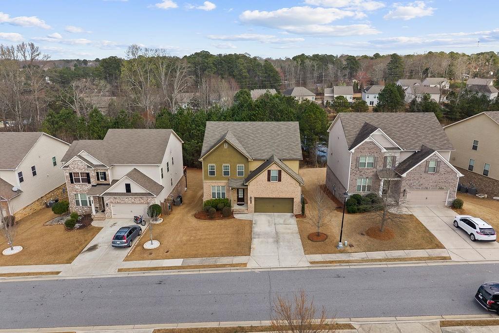 2415 Matlin Way Buford, GA 30519 - Photo 61 of 66 an aerial view of residential houses with outdoor space and parking