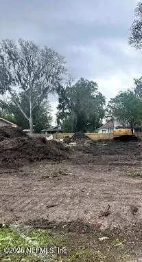 a view of a street with trees