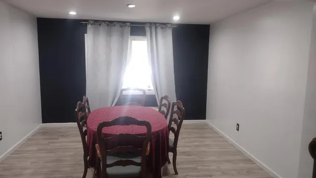 a view of a hallway with a wooden floors