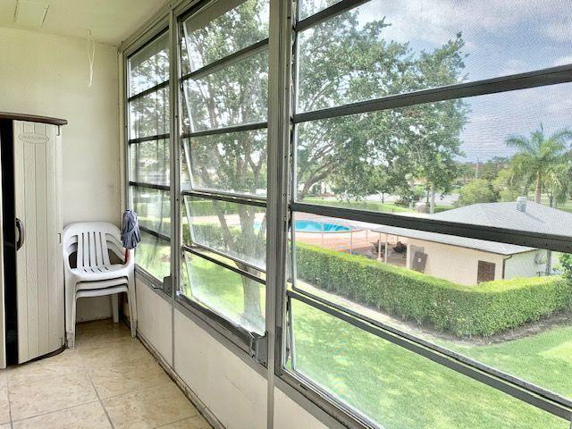 164 Suffolk F Boca Raton, FL 33434 - Photo 10 of 19 Enclosed Patio w/Pool View
