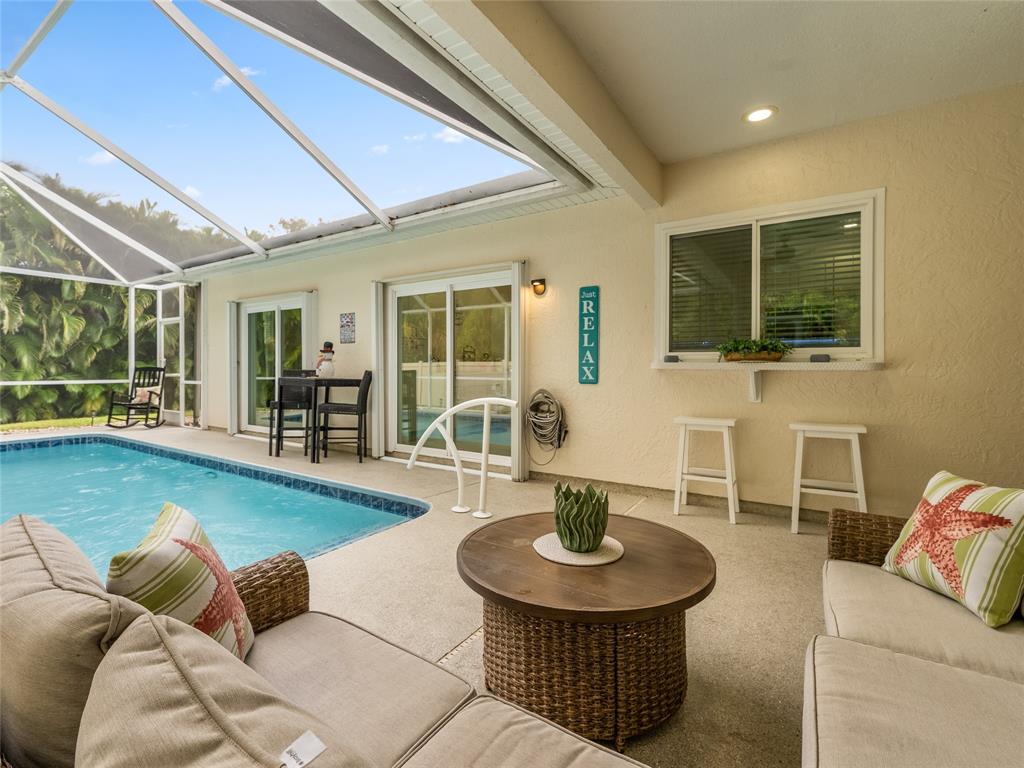4480 23rd Way Vero Beach, FL 32966 - Photo 27 of 29 a living room with furniture and a potted plant
