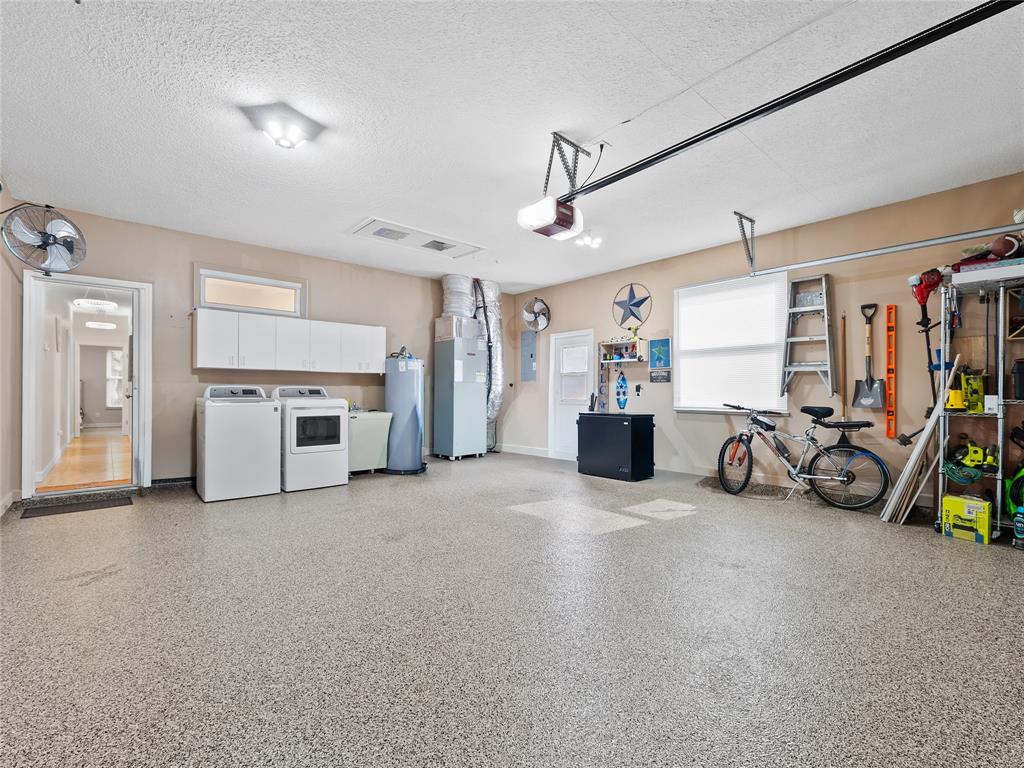 4480 23rd Way Vero Beach, FL 32966 - Photo 28 of 29 a view of a livingroom with furniture and a garage