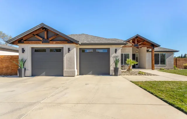 a front view of a house with yard