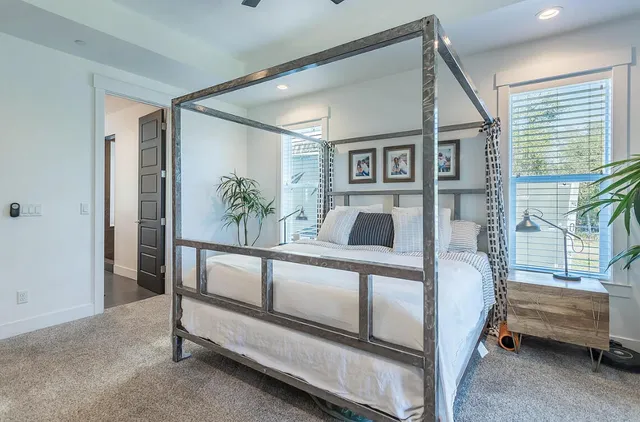 a bedroom with furniture and a window