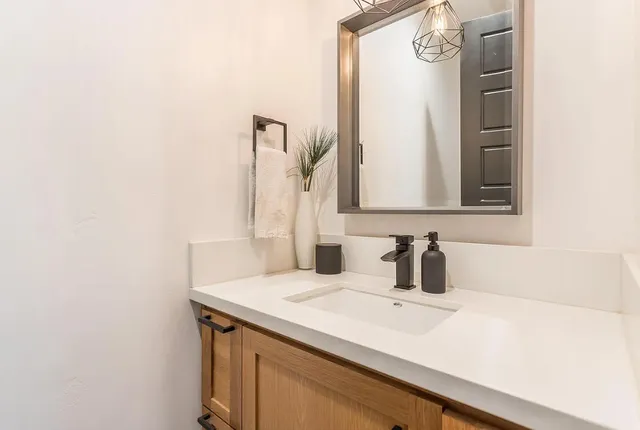 a bathroom with a sink and a mirror