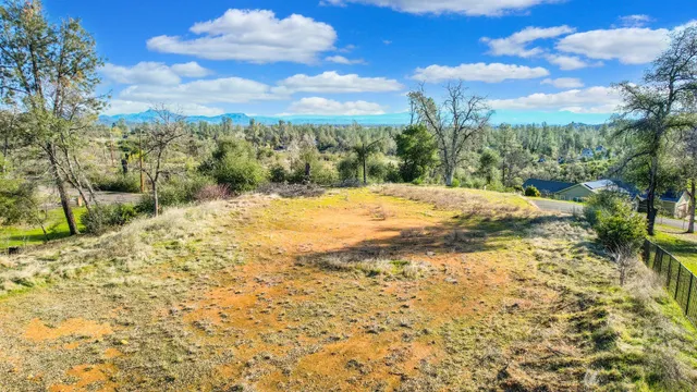 a view of a yard with an outdoor seating