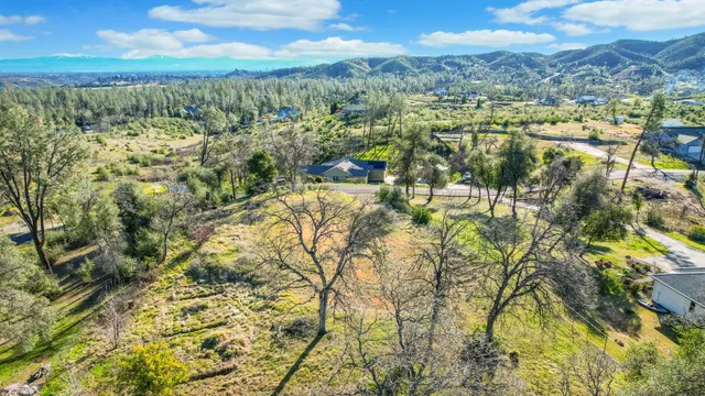 a view of a city with mountains in the background