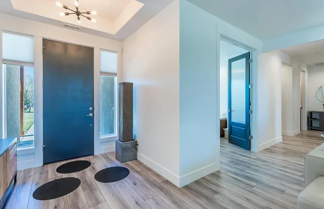 a view of a livingroom with furniture and wooden floor