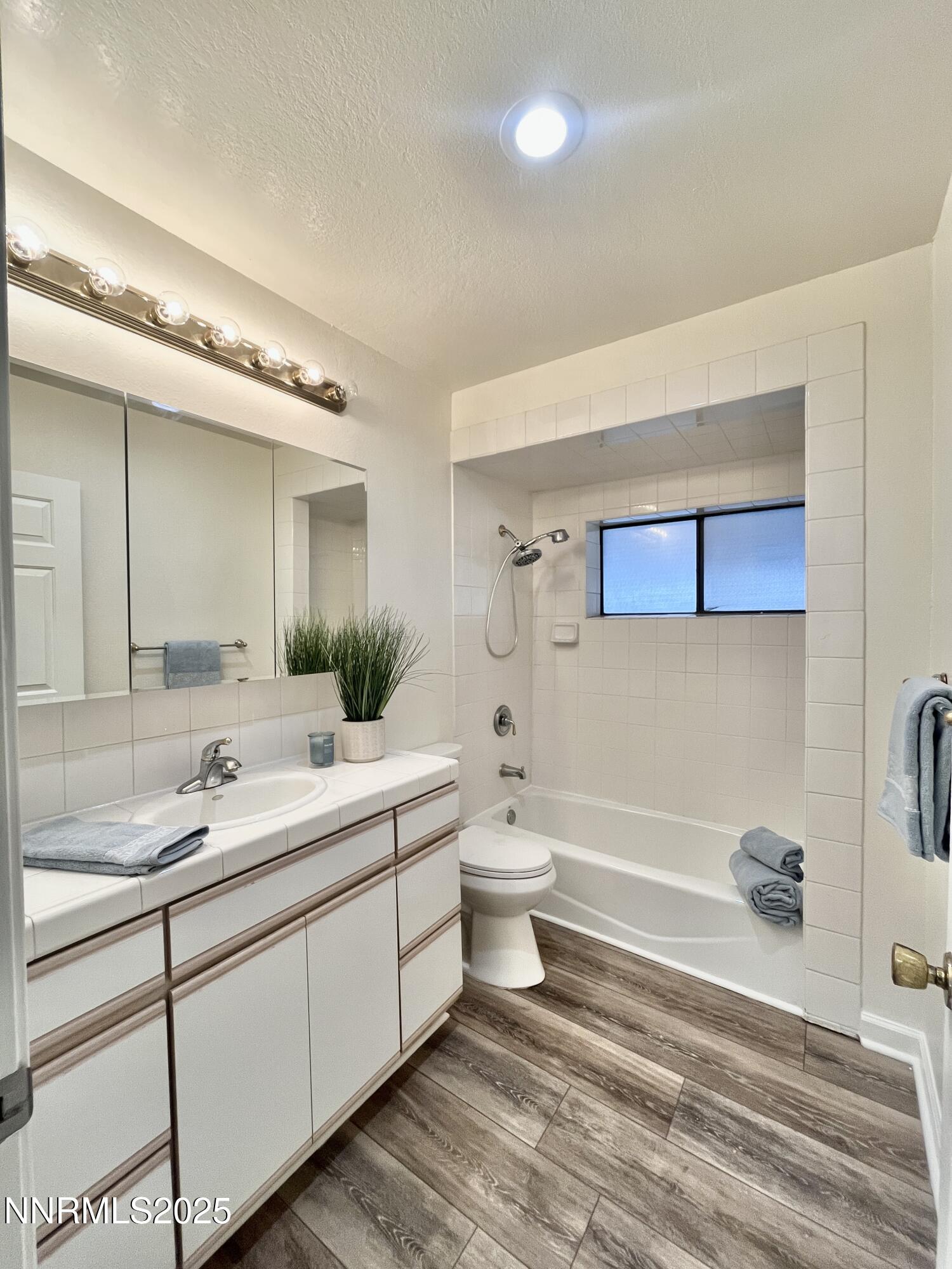 506 East Taylor Street Reno, NV 89502 - Photo 4 of 12 a bathroom with a double vanity sink mirror and toilet