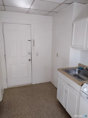 a kitchen with a sink and cabinets