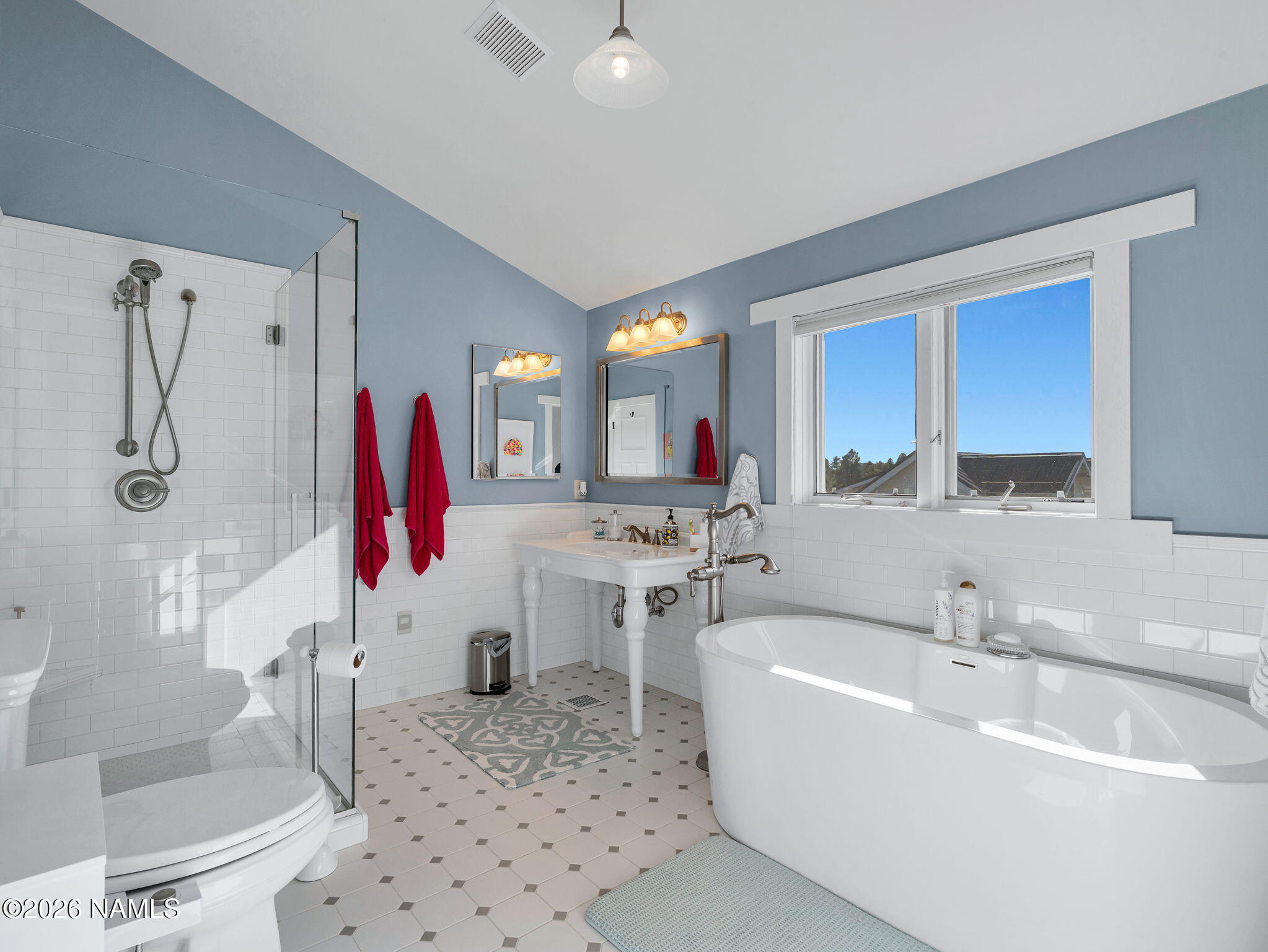 15739 Rabbit Brush Road Parks, AZ 86018 - Photo 41 of 67 a bathroom with a tub sink and mirror