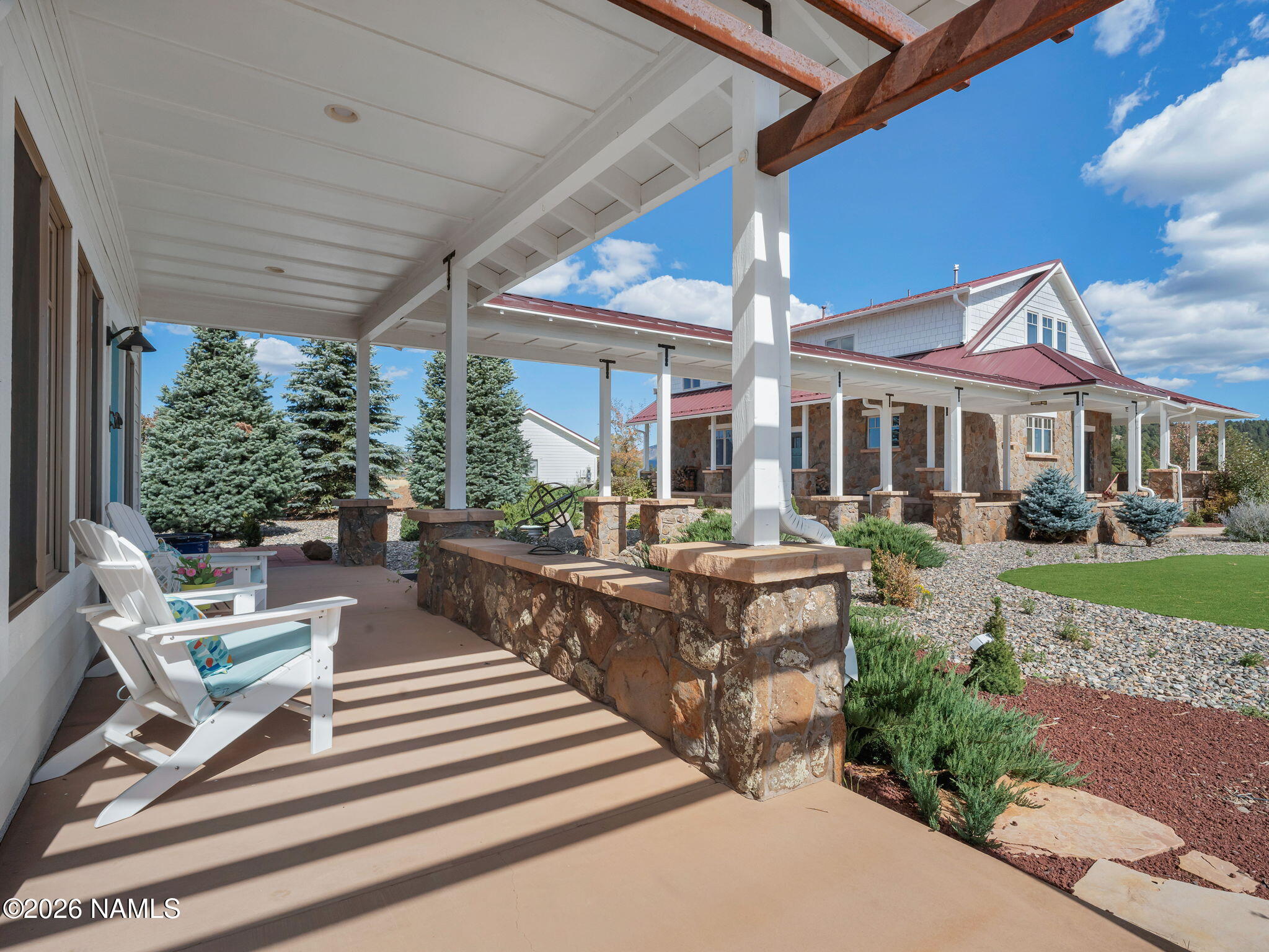 15739 Rabbit Brush Road Parks, AZ 86018 - Photo 45 of 67 a view of a patio with couches table and chairs and potted plants