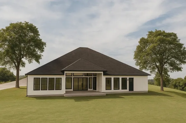 a front view of a house with a garden