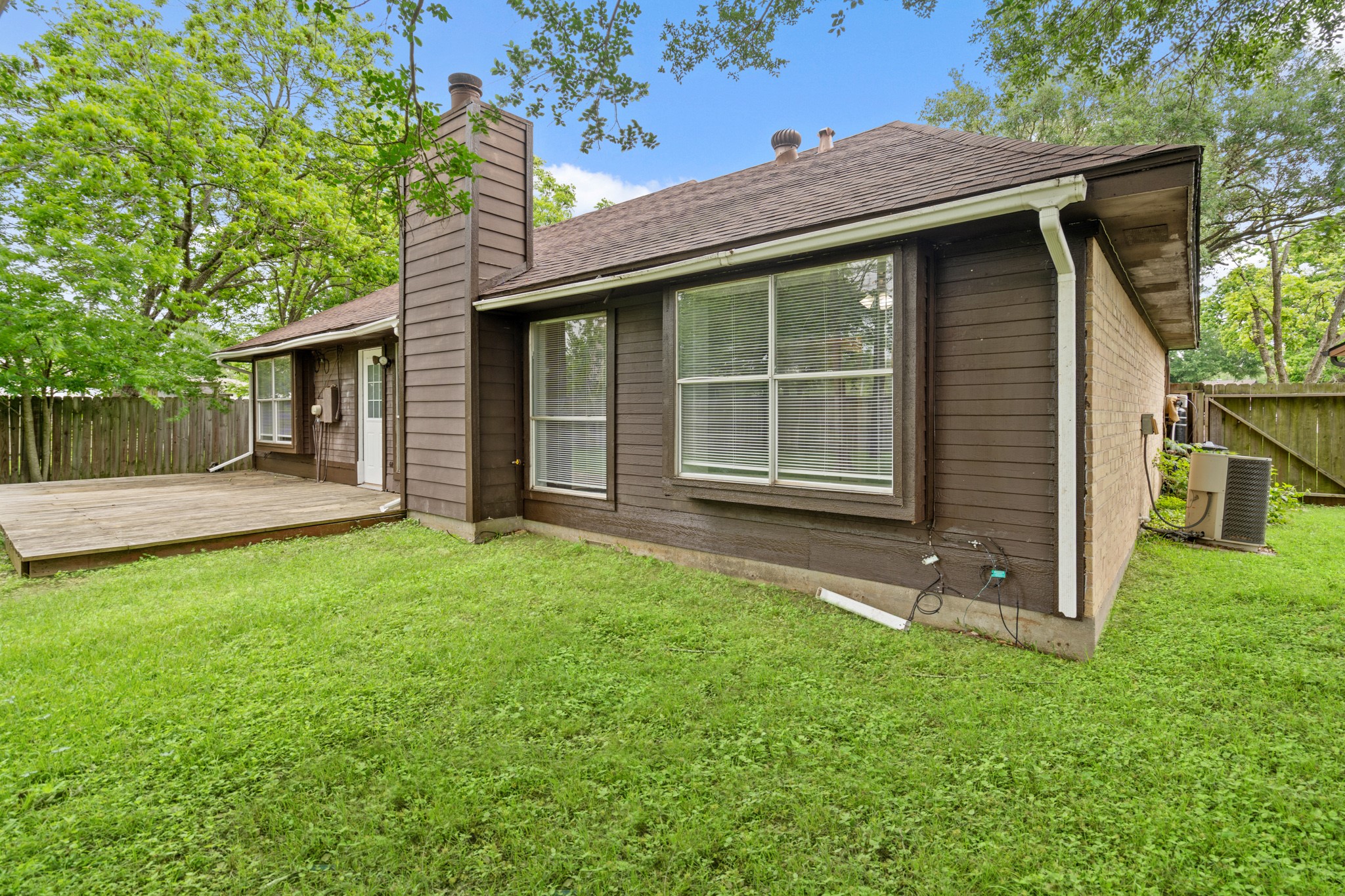 2220 Spruce Drive Rosenberg, TX 77471 - Photo 17 of 18 The backyard offers direct access into the home, making indoor-outdoor living easy and convenient.