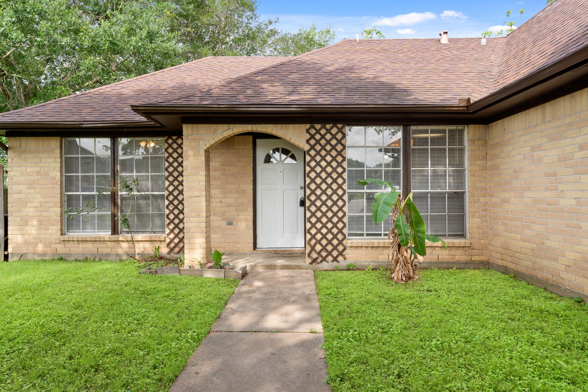 2220 Spruce Drive Rosenberg, TX 77471 - Photo 3 of 18 The home features a covered entry, providing a welcoming and sheltered entrance.