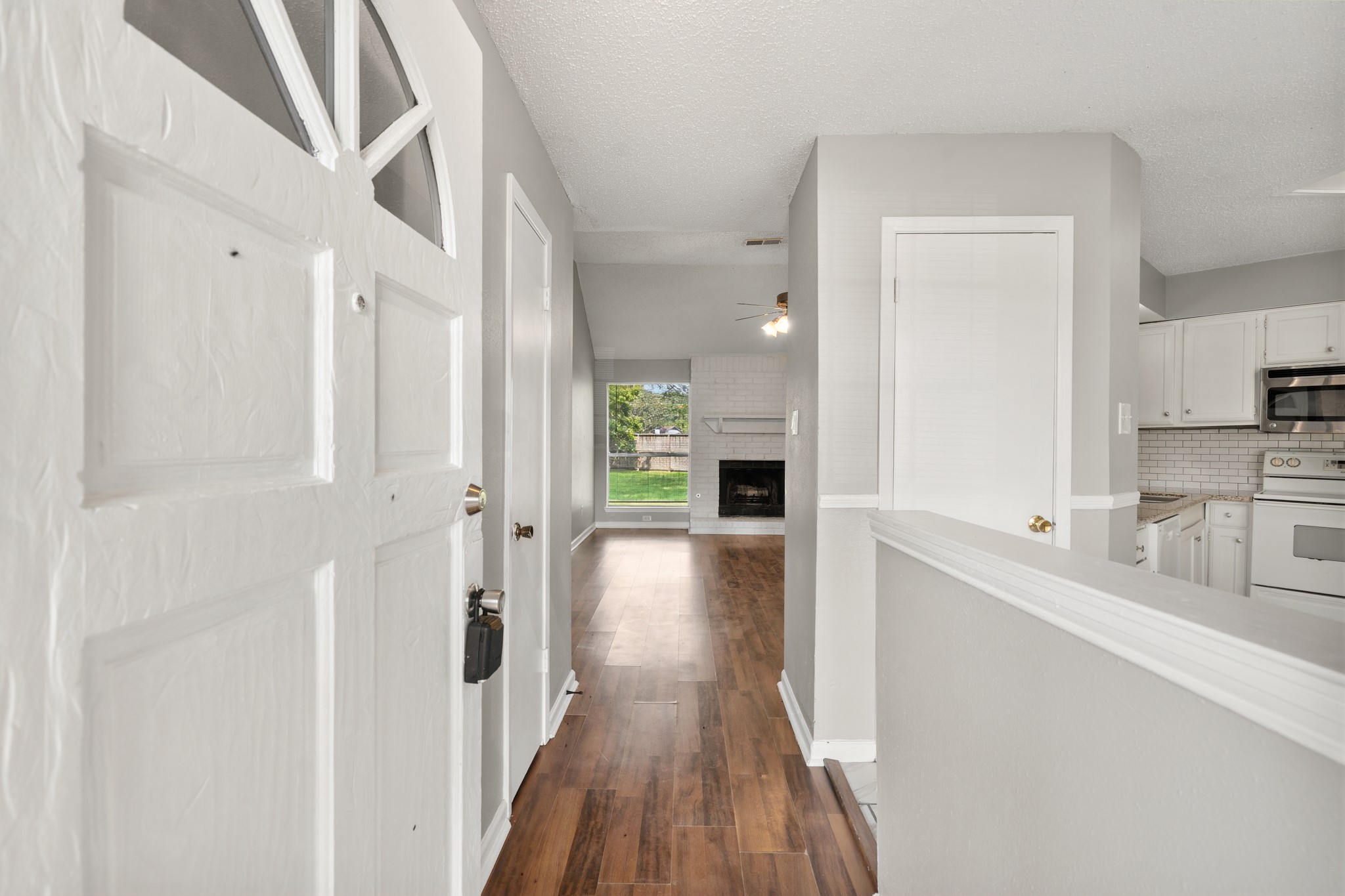 2220 Spruce Drive Rosenberg, TX 77471 - Photo 4 of 18 Step inside to find the kitchen immediately to the right, with the living room located straight ahead.