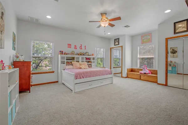 a bedroom with furniture and a chandelier