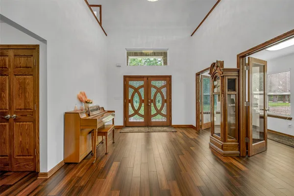 a view of an entryway with wooden floor