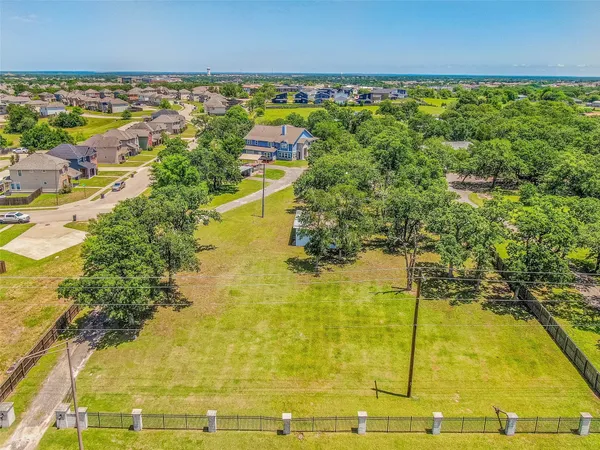 view of a swimming pool with outdoor seating and plants