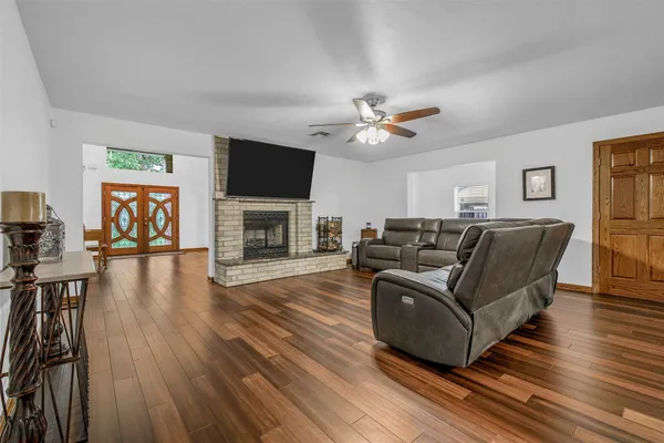 a living room with furniture fireplace and flat screen tv
