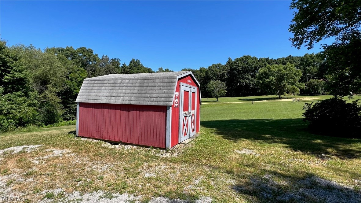 239 Waynesburg Road Northeast Carrollton, OH 44615 - Photo 5 of 14 Storage shed allows extra space for mowers and outdoor equipment.