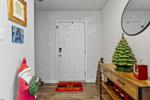 a view of an entryway with wooden floor