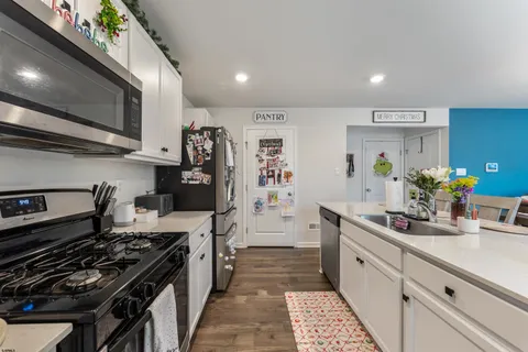 a kitchen with a stove and a refrigerator