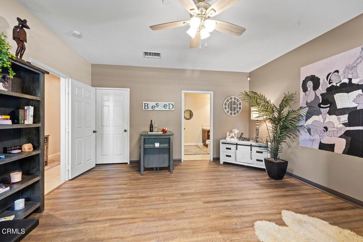 3004 Moonlight Park Avenue Oxnard, CA 93036 - Photo 13 of 28 a living room with furniture and a wooden floor