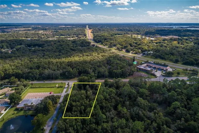 an aerial view of residential houses with outdoor space and swimming pool