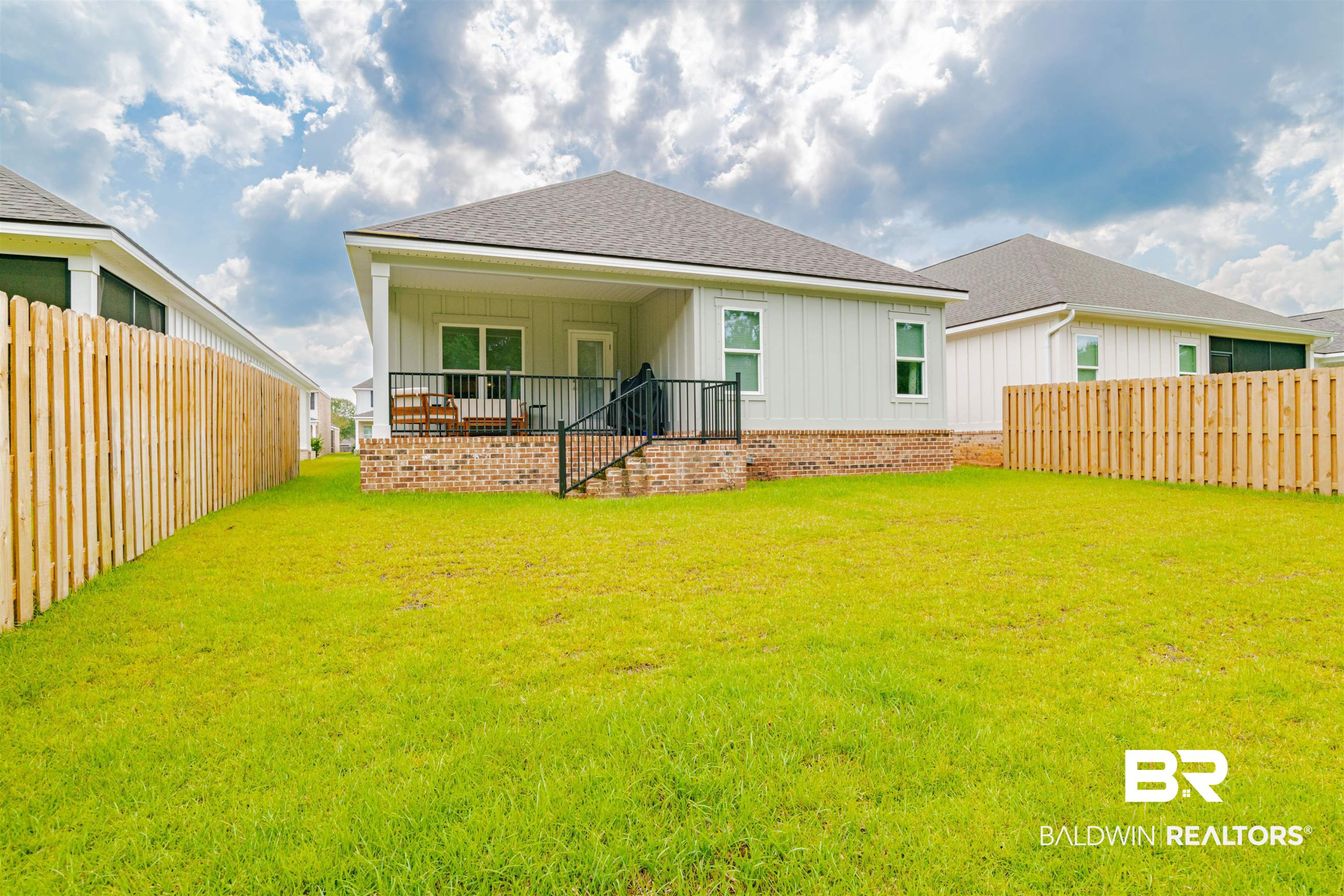 655 H Norman Lane Fairhope, AL 36532 - Photo 26 of 30 Back of property featuring a yard