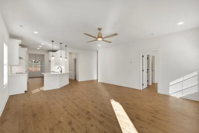 a view of a kitchen with a sink and a refrigerator