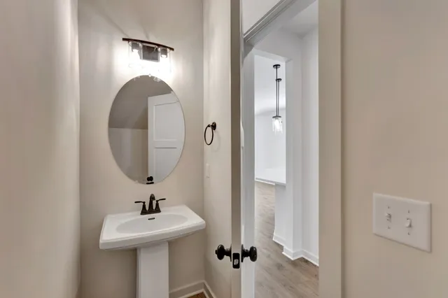 a bathroom with a sink and mirror