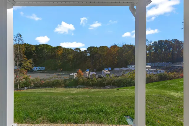 a view of a golf club with a backyard