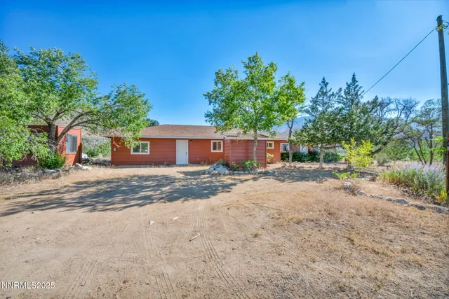 a view of a house with a yard and garage