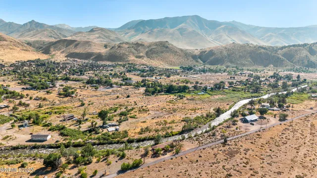 a view of a town with mountains in the background