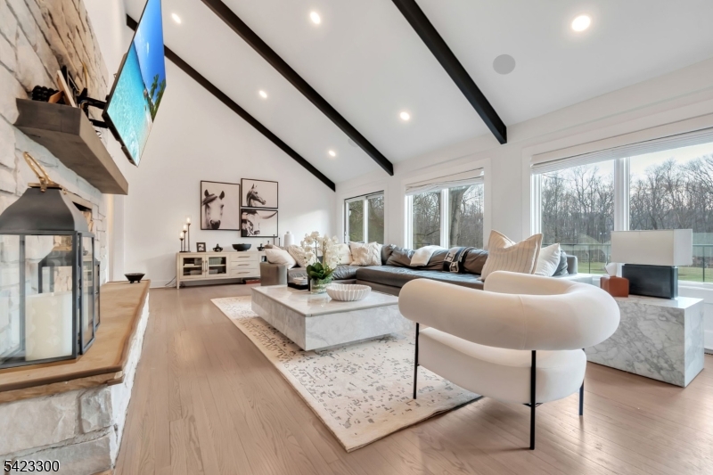 16 East Greenbrook Road North Caldwell, NJ 07006 - Photo 11 of 45 a living room with furniture and a large window