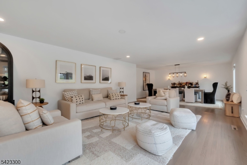 16 East Greenbrook Road North Caldwell, NJ 07006 - Photo 15 of 45 a living room with furniture and a wooden floor