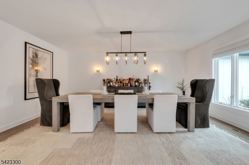 16 East Greenbrook Road North Caldwell, NJ 07006 - Photo 16 of 45 a view of a dining room with furniture and chandelier