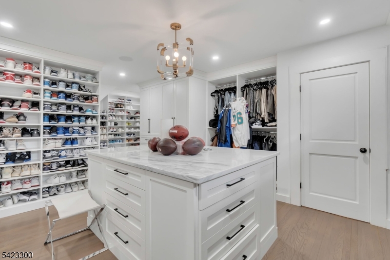 16 East Greenbrook Road North Caldwell, NJ 07006 - Photo 20 of 45 a kitchen with a cabinets and chandelier