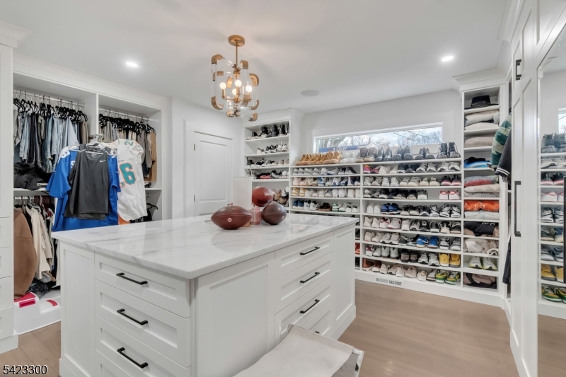 16 East Greenbrook Road North Caldwell, NJ 07006 - Photo 21 of 45 a kitchen that has a lot of cabinets a sink and a wooden floor