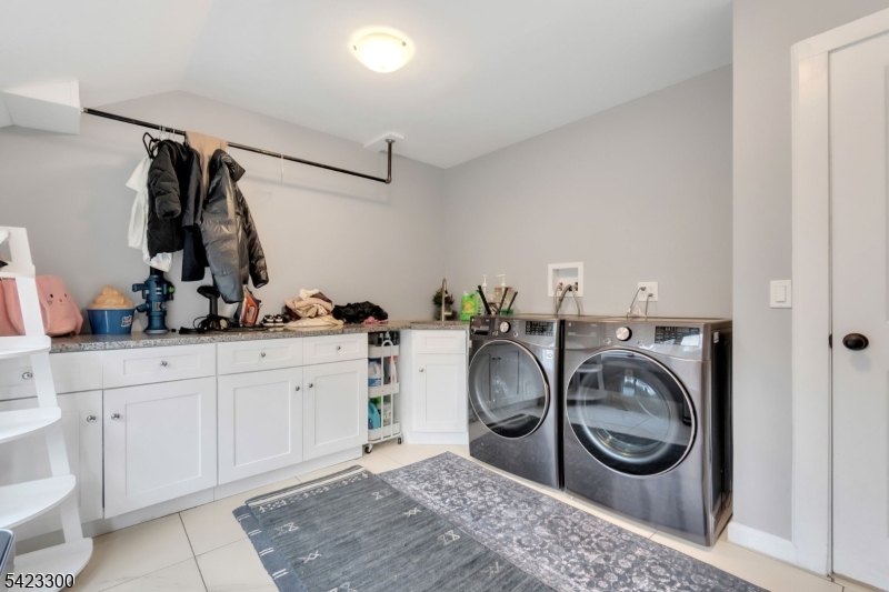 16 East Greenbrook Road North Caldwell, NJ 07006 - Photo 23 of 45 a utility room with sink dryer and washer
