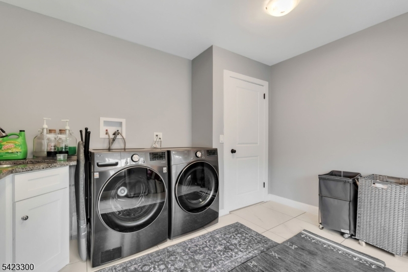16 East Greenbrook Road North Caldwell, NJ 07006 - Photo 24 of 45 a utility room with dryer and washer