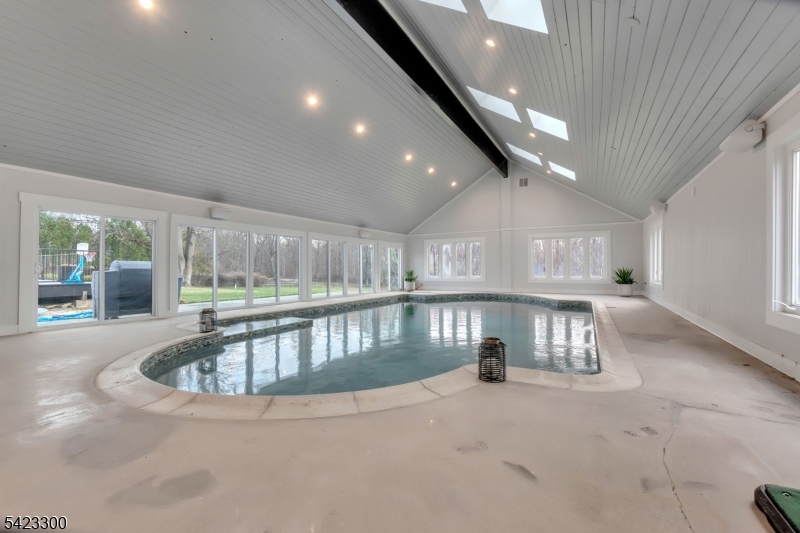 16 East Greenbrook Road North Caldwell, NJ 07006 - Photo 25 of 45 a view of indoor swimming pool and fire pit