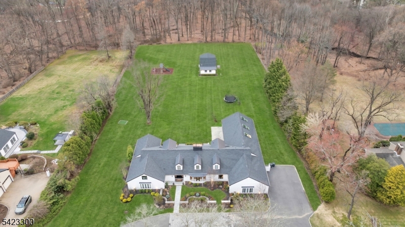 16 East Greenbrook Road North Caldwell, NJ 07006 - Photo 3 of 45 an aerial view of a house with a yard basket ball court and outdoor seating
