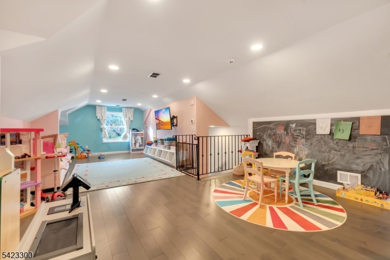 16 East Greenbrook Road North Caldwell, NJ 07006 - Photo 31 of 45 a living room with lots of furniture and a table