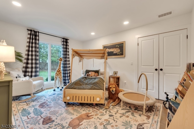 16 East Greenbrook Road North Caldwell, NJ 07006 - Photo 32 of 45 a bedroom with furniture and a window
