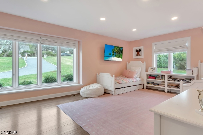 16 East Greenbrook Road North Caldwell, NJ 07006 - Photo 33 of 45 a bedroom with furniture and a large window
