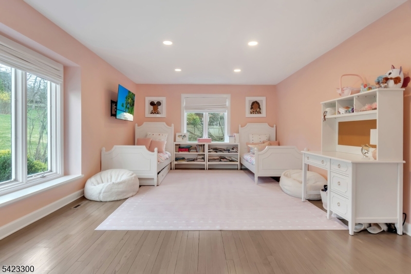16 East Greenbrook Road North Caldwell, NJ 07006 - Photo 34 of 45 a bedroom with furniture and a large window