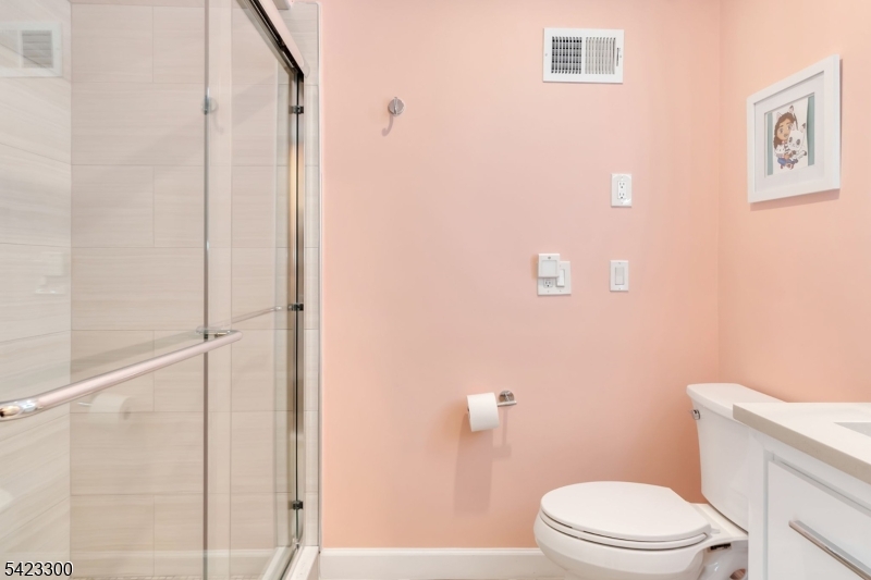 16 East Greenbrook Road North Caldwell, NJ 07006 - Photo 36 of 45 a white toilet sitting next to a bathroom sink