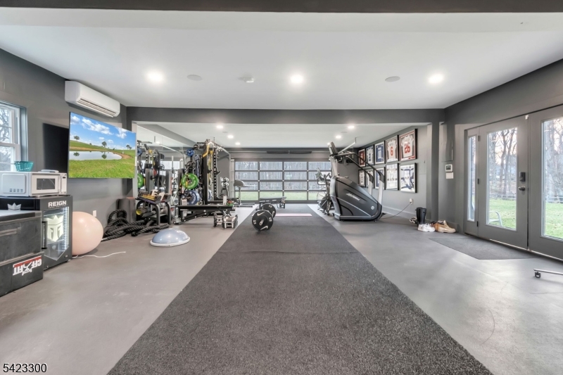 16 East Greenbrook Road North Caldwell, NJ 07006 - Photo 37 of 45 a view of a room with gym equipment